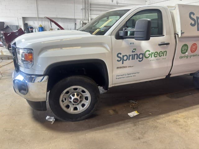 Front-end collision, GMC work truck — after repair